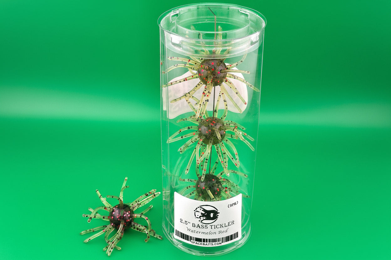 Clear container with fishing lures labeled 'Bass Tickler' on a green background