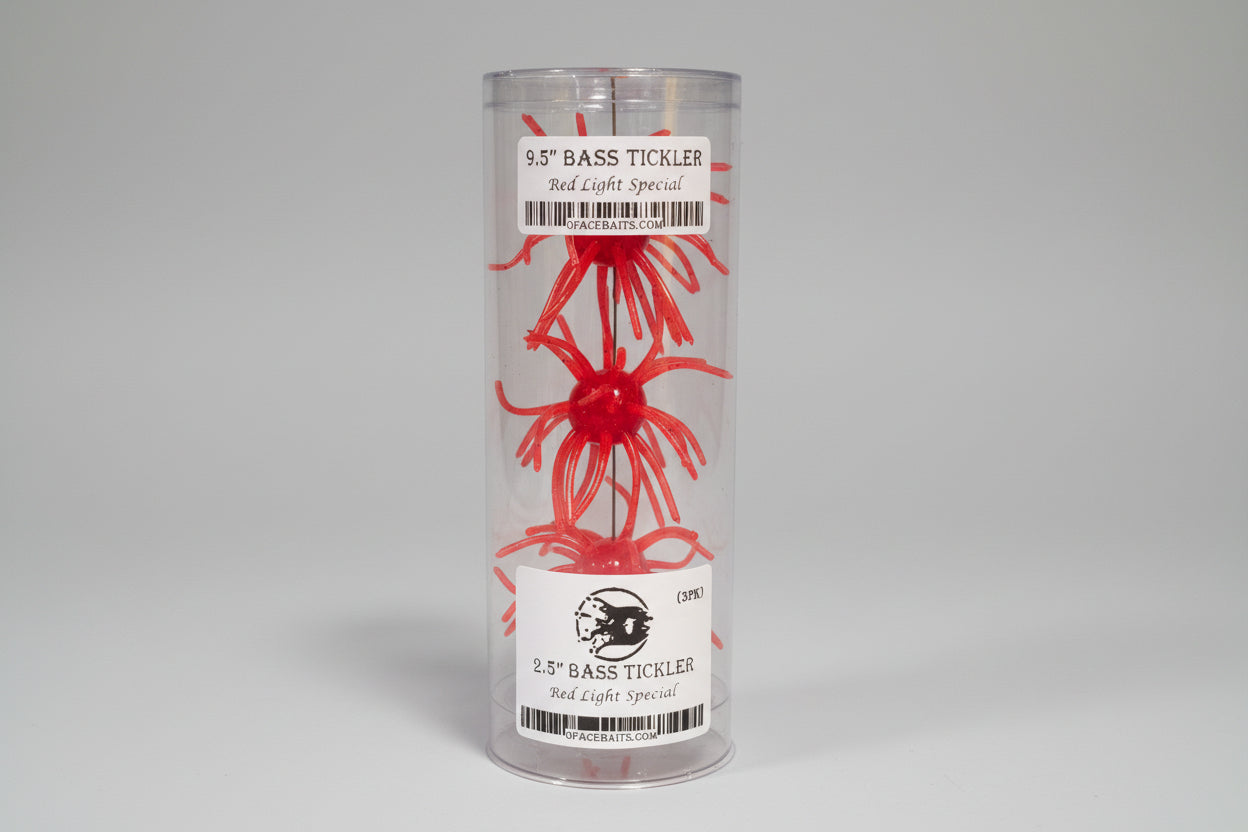 Red fishing lure in packaging with a label white background