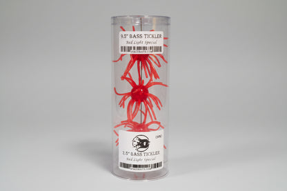 Red fishing lure in packaging with a label white background